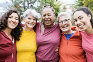 Diverse women smiling standing in solidarity